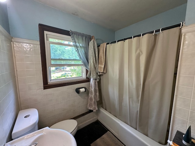 402 Grouse St, Sandstone, MN 55072 - full bathroom with tile walls and shower / tub combo with curtain