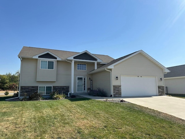2007 Pratt Cir, Saint Peter, MN 56082 - view of front of property with stone siding, driveway, a garage, a front yard, and a shingled roof