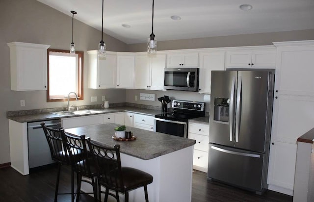 2007 Pratt Cir, Saint Peter, MN 56082 - kitchen featuring stainless steel appliances, dark wood-type flooring, lofted ceiling, white cabinets, and dark countertops