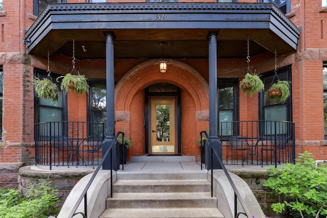 1520 Elliot Ave Unit 4, Minneapolis, MN 55404 - view of exterior entry with brick siding and a porch