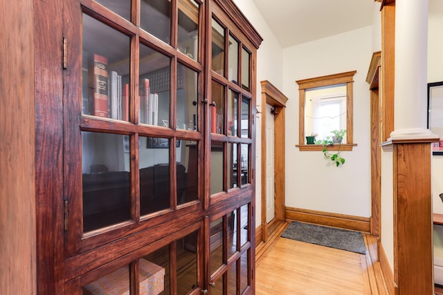 1520 Elliot Ave Unit 4, Minneapolis, MN 55404 - doorway to outside featuring wood finished floors and ornate columns