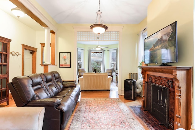 1520 Elliot Ave Unit 4, Minneapolis, MN 55404 - living area with wood finished floors, a fireplace with flush hearth, and ceiling fan