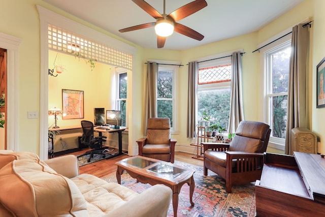 1520 Elliot Ave Unit 4, Minneapolis, MN 55404 - living room with wood finished floors, ceiling fan, and a desk