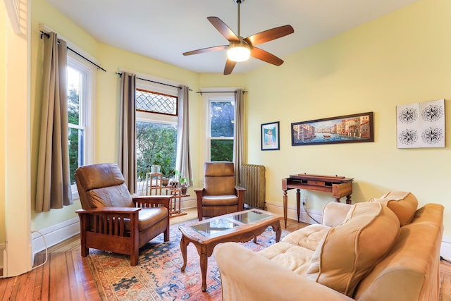 1520 Elliot Ave Unit 4, Minneapolis, MN 55404 - living room with a ceiling fan, wood-type flooring, and radiator heating unit