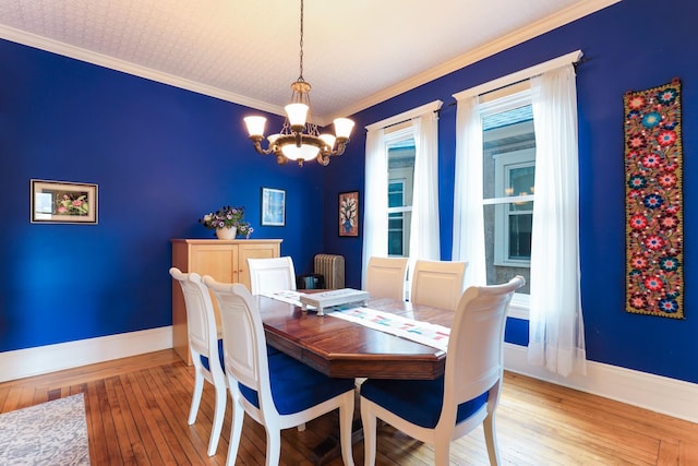 1520 Elliot Ave Unit 4, Minneapolis, MN 55404 - dining room featuring a chandelier, hardwood / wood-style floors, and crown molding