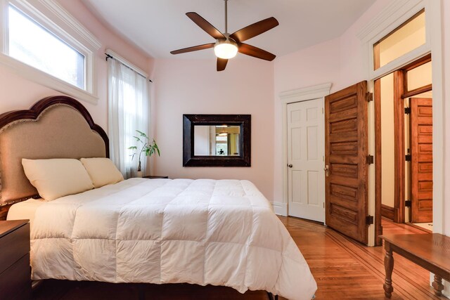 1520 Elliot Ave Unit 4, Minneapolis, MN 55404 - bedroom with light wood-type flooring and ceiling fan
