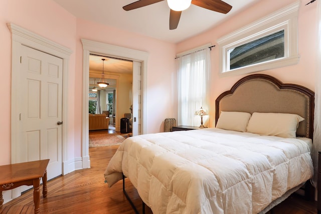 1520 Elliot Ave Unit 4, Minneapolis, MN 55404 - bedroom featuring multiple windows, wood finished floors, and ceiling fan