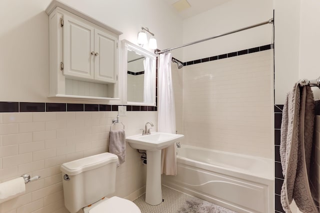1520 Elliot Ave Unit 4, Minneapolis, MN 55404 - bathroom with shower / tub combo, tile walls, and tile patterned flooring