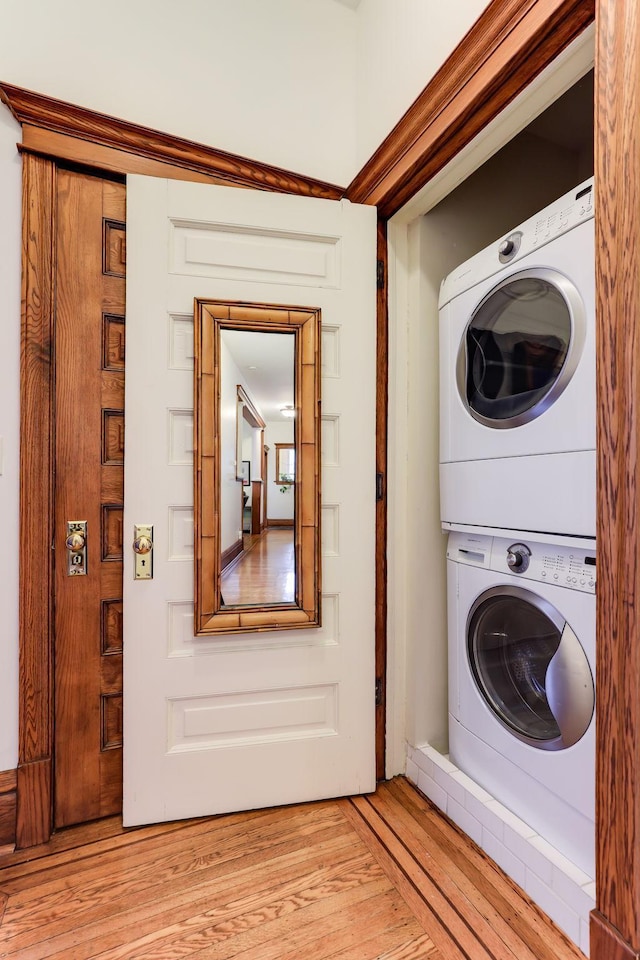 1520 Elliot Ave Unit 4, Minneapolis, MN 55404 - laundry room featuring stacked washer / dryer and light wood-type flooring