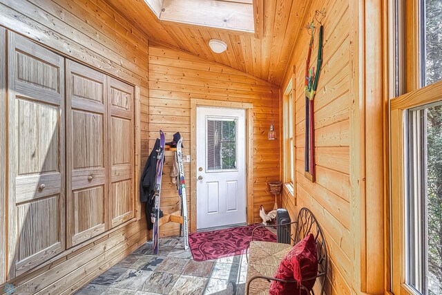 12104 County Highway 17, Lake View Twp, MN 56501 - entryway featuring vaulted ceiling, wooden walls, stone finish floors, and wood ceiling