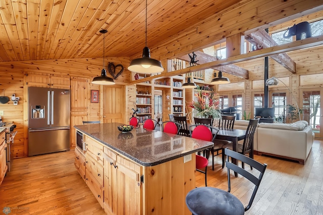 12104 County Highway 17, Lake View Twp, MN 56501 - kitchen with stainless steel appliances, wood walls, light wood-style floors, a center island, and wood ceiling
