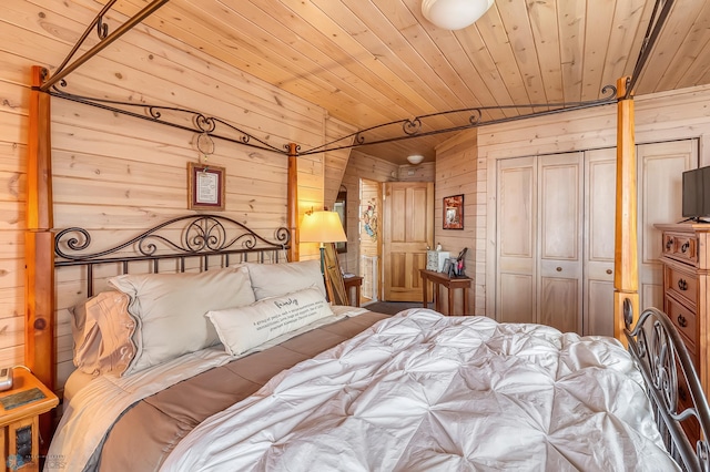 12104 County Highway 17, Lake View Twp, MN 56501 - bedroom featuring wood walls, wooden ceiling, and a closet