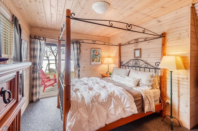 12104 County Highway 17, Lake View Twp, MN 56501 - carpeted bedroom featuring wooden ceiling, wooden walls, and access to outside