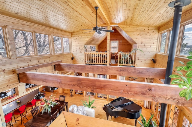 12104 County Highway 17, Lake View Twp, MN 56501 - dining area view of a wooden ceiling with exposed beams, wood walls, and a ceiling fan