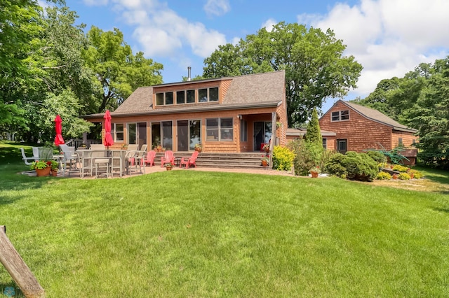 12104 County Highway 17, Lake View Twp, MN 56501 - rear view of house with a lawn and a patio