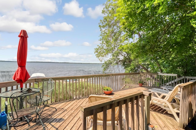 12104 County Highway 17, Lake View Twp, MN 56501 - wooden deck featuring a water view and outdoor dining space