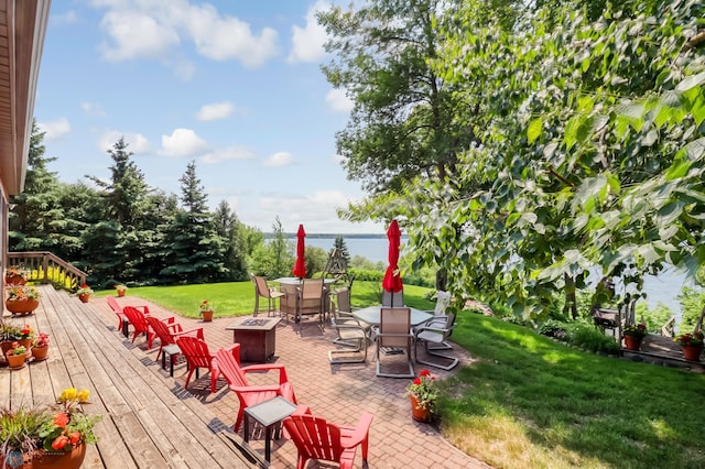 12104 County Highway 17, Lake View Twp, MN 56501 - wooden deck with an outdoor fire pit, outdoor dining space, and a yard
