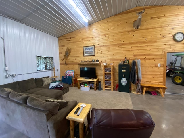 20668 County Road 41, Bremen Twp, MN 55795 - living area with vaulted ceiling, finished concrete flooring, and wooden walls
