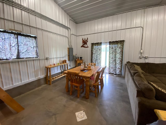20668 County Road 41, Bremen Twp, MN 55795 - dining area with finished concrete flooring and metal wall