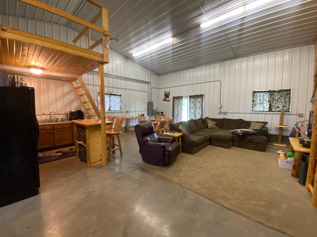 20668 County Road 41, Bremen Twp, MN 55795 - garage featuring freestanding refrigerator and metal wall
