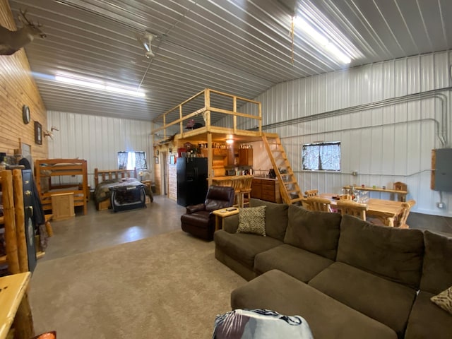 20668 County Road 41, Bremen Twp, MN 55795 - living room featuring concrete floors and metal wall