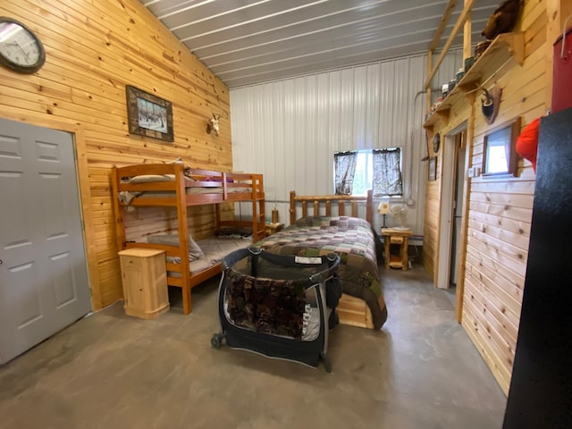 20668 County Road 41, Bremen Twp, MN 55795 - bedroom with concrete floors, wooden walls, and lofted ceiling