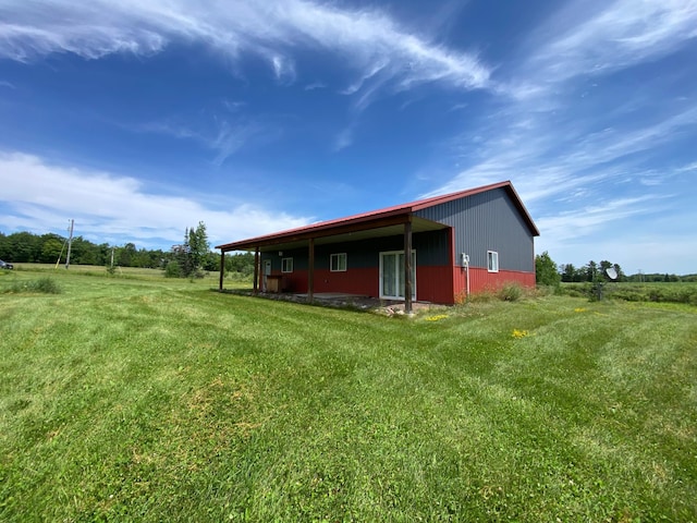 20668 County Road 41, Bremen Twp, MN 55795 - view of side of home featuring an outbuilding and a yard
