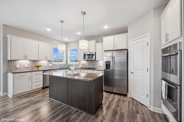 15742 Everglade Ave, Apple Valley, MN 55124 - kitchen featuring stainless steel appliances, dark wood finished floors, backsplash, white cabinets, and recessed lighting