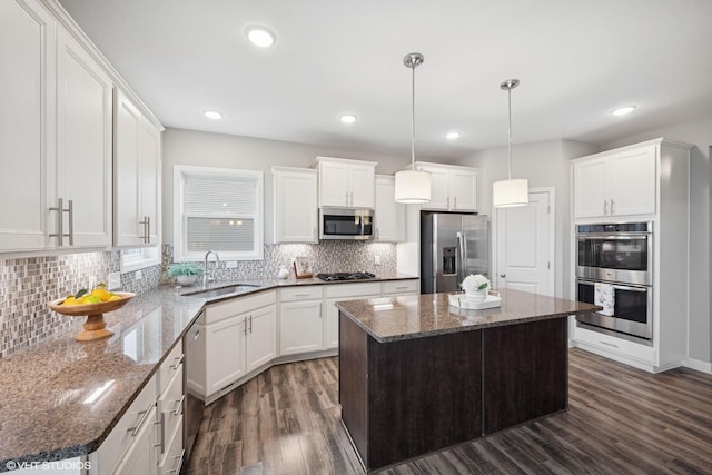 15742 Everglade Ave, Apple Valley, MN 55124 - kitchen with stainless steel appliances, dark wood finished floors, decorative backsplash, white cabinetry, and recessed lighting