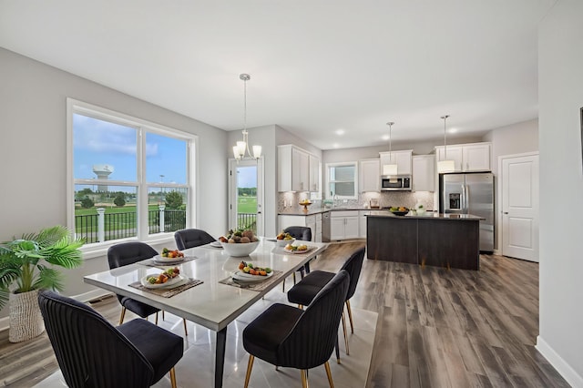 15742 Everglade Ave, Apple Valley, MN 55124 - dining space with wood finished floors and a chandelier