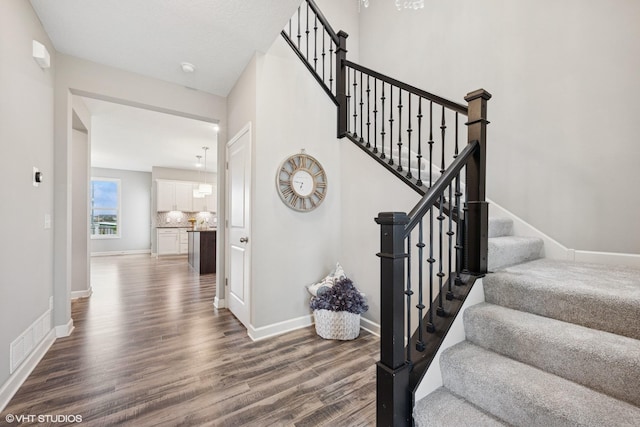 15742 Everglade Ave, Apple Valley, MN 55124 - stairway featuring wood finished floors and baseboards