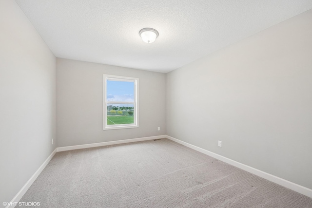 15742 Everglade Ave, Apple Valley, MN 55124 - carpeted empty room featuring baseboards and a textured ceiling