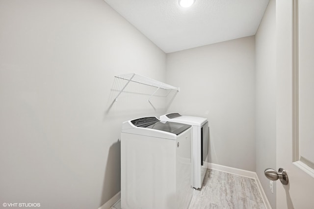 15742 Everglade Ave, Apple Valley, MN 55124 - laundry room featuring washer and dryer and a textured ceiling