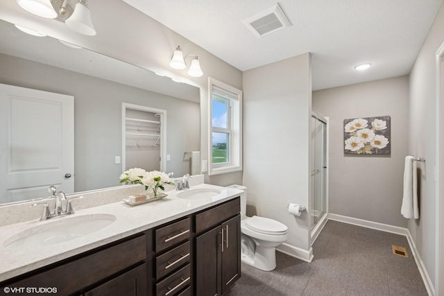 15742 Everglade Ave, Apple Valley, MN 55124 - full bathroom with a shower stall, double vanity, a spacious closet, and recessed lighting