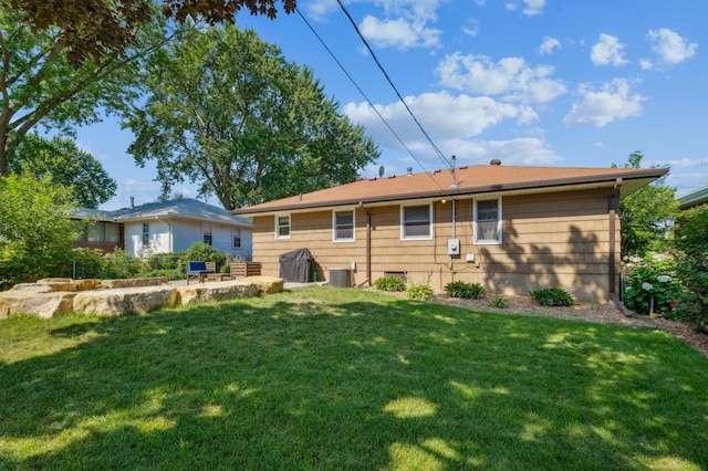 3355 Central Ave NE, Minneapolis, MN 55418 - rear view of property with a lawn and a patio area