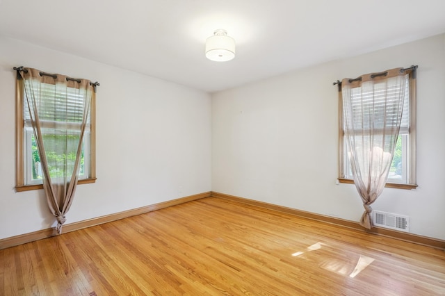 3355 Central Ave NE, Minneapolis, MN 55418 - spare room featuring light wood finished floors and baseboards