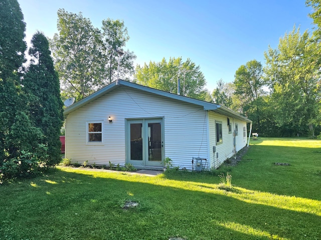 106 Railroad Ave W, Onamia, MN 56359 - rear view of house with a lawn