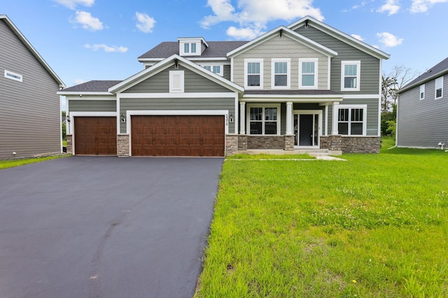 5370 Fountain Ln N, Plymouth, MN 55446 - craftsman-style house with driveway, a garage, a front lawn, and stone siding