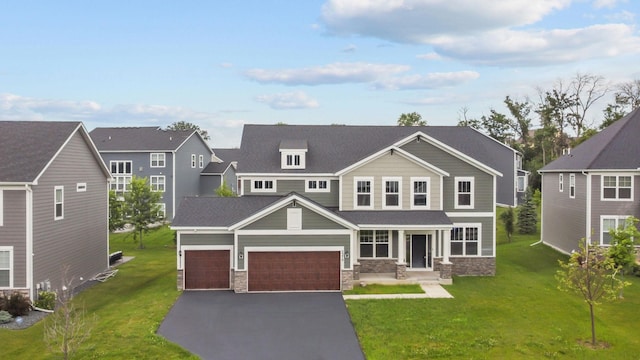 5370 Fountain Ln N, Plymouth, MN 55446 - view of front of home with stone siding, driveway, a front lawn, and a garage