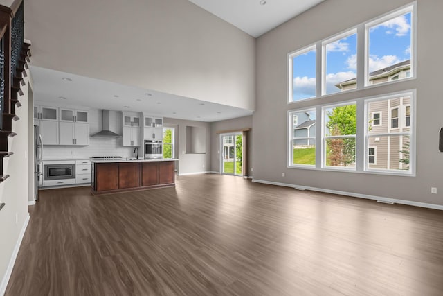 5370 Fountain Ln N, Plymouth, MN 55446 - unfurnished living room with dark wood-style floors and a high ceiling