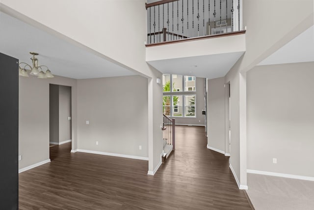 5370 Fountain Ln N, Plymouth, MN 55446 - entryway with a chandelier, wood finished floors, stairs, and a high ceiling