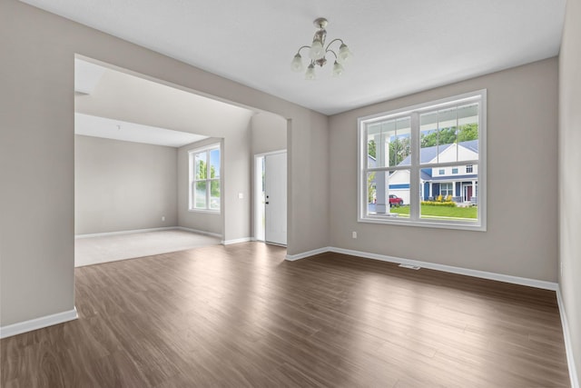 5370 Fountain Ln N, Plymouth, MN 55446 - unfurnished room with a chandelier and wood finished floors