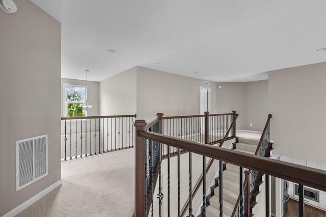 5370 Fountain Ln N, Plymouth, MN 55446 - corridor featuring an upstairs landing and carpet flooring