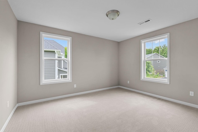 5370 Fountain Ln N, Plymouth, MN 55446 - unfurnished room featuring plenty of natural light and carpet flooring