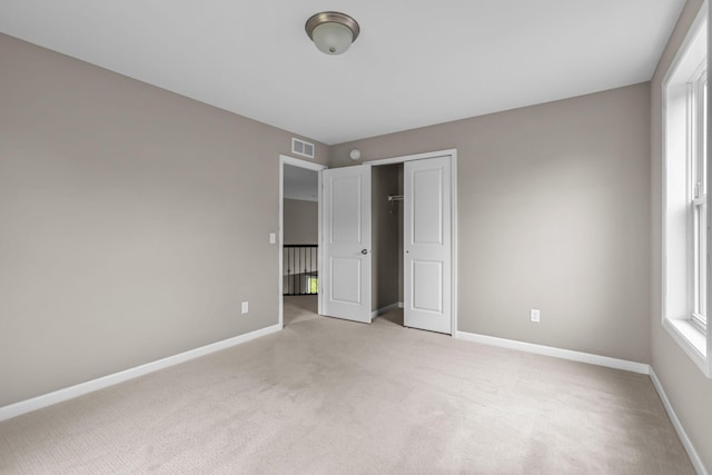 5370 Fountain Ln N, Plymouth, MN 55446 - unfurnished bedroom featuring light carpet and a closet