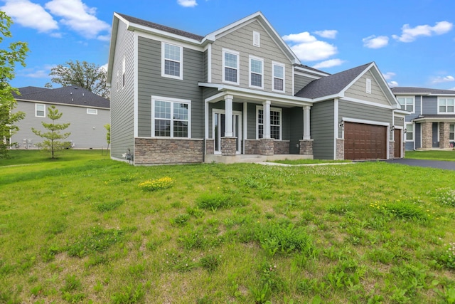 5390 Everest Ln N, Plymouth, MN 55446 - craftsman-style home with a porch, stone siding, a front lawn, and driveway