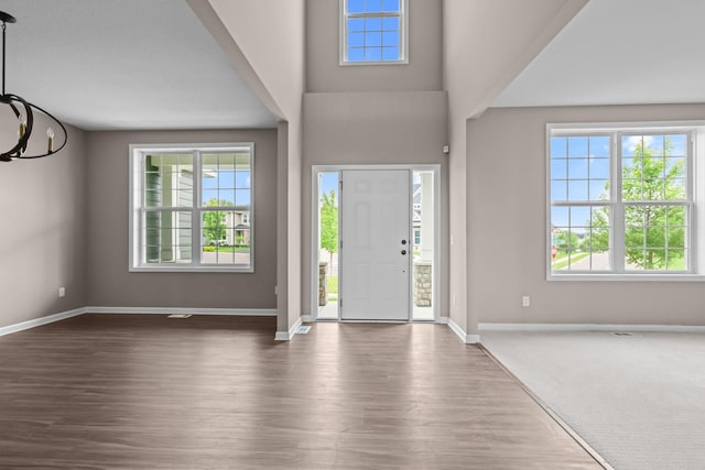 5390 Everest Ln N, Plymouth, MN 55446 - foyer featuring plenty of natural light, dark wood-type flooring, and a chandelier