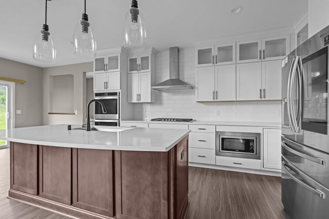 5390 Everest Ln N, Plymouth, MN 55446 - kitchen featuring stainless steel appliances, wall chimney exhaust hood, dark wood-style floors, and light countertops