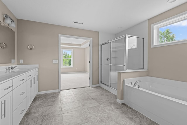 5390 Everest Ln N, Plymouth, MN 55446 - full bath featuring double vanity, a garden tub, plenty of natural light, and a shower stall