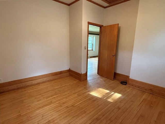 2999 18th St, Oak Grove Twp, WI 54868 - unfurnished room featuring crown molding and light wood-style floors